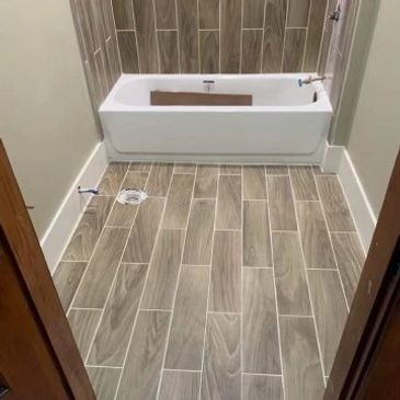 Bathroom update with tile floor.