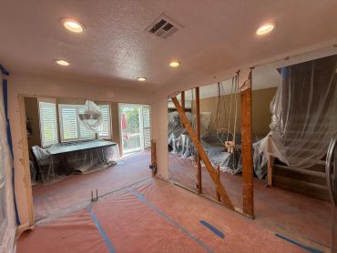 Shown from the opposite corner you can see how the kitchen now opens up to the rest of the room.