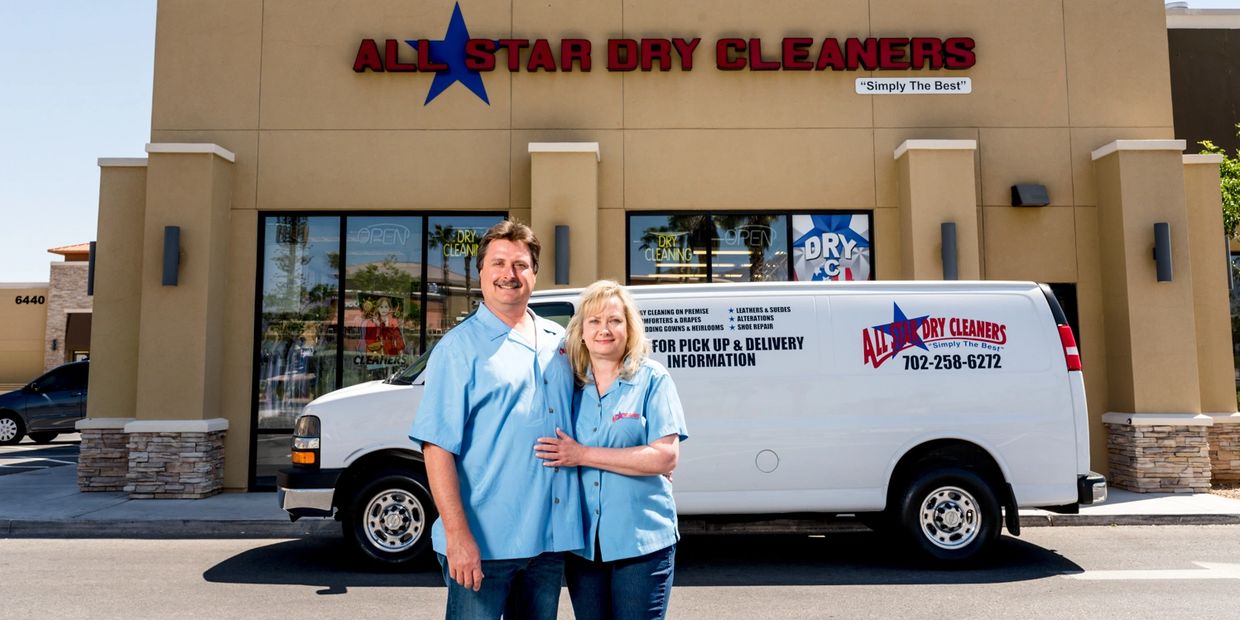 Couple posing in front of all stars dry cleaners
