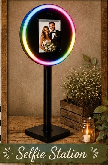 Colorful selfie station with a wedding photo inside the illuminated ring.