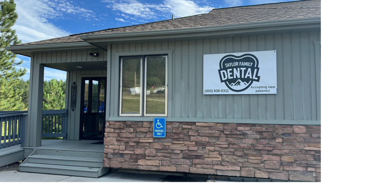 Entrance of Taylor Family Dental with a clear blue sky.