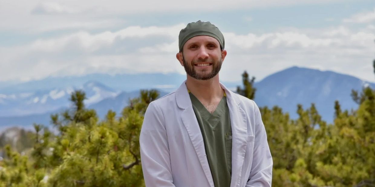 Dr. Andrew Trent Taylor of Taylor Family Dental standing in front the the mountains