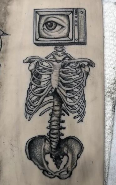 Skeleton with a TV head displaying an eye, blending anatomy and technology.
