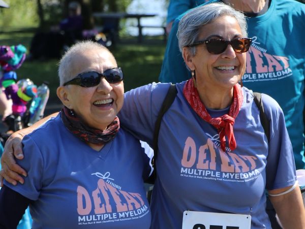 Two people smiling during the race