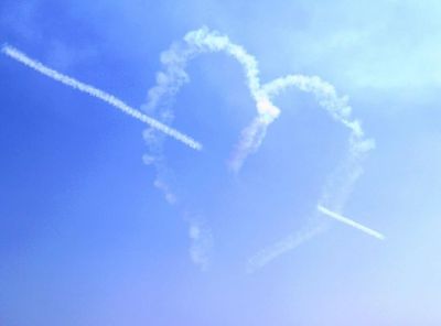 Heart shaped pattern in a blue sky created by the Red Arrows in Eastbourne Airbourne Show