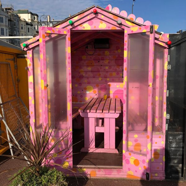 Pink beach hut at Goat Ledge cafe on St Leonards and Hastings seafront