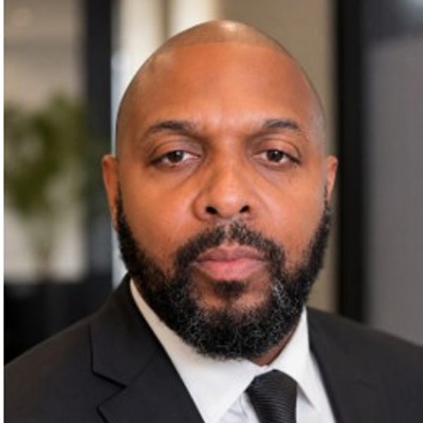 Portrait of a serious man in a suit and tie.
