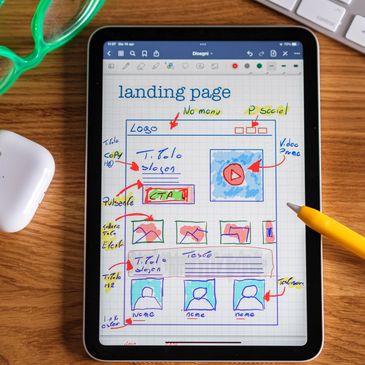 Tablet with hand-drawn landing page layout ideas