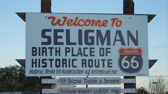 Welcome to Seligman, Arizona sign proclaiming the town the birthplace of Historic Route 66