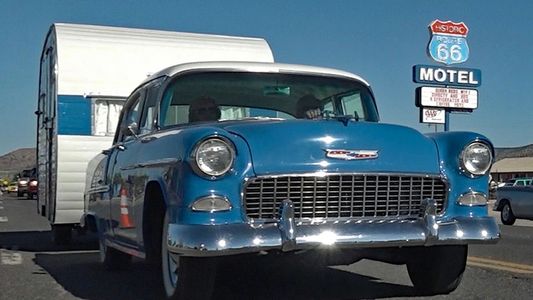 Route 66 travel is fun when you go in style - vintage trailer with classic car heading for a RV Park in Arizona.