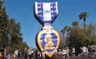 Large purple heat display at the Phoenix, Arizona Veterans Day Parade.