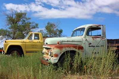 Old vehicles on the side of the road in Seligman, Arizona on Historic Route 66. 
