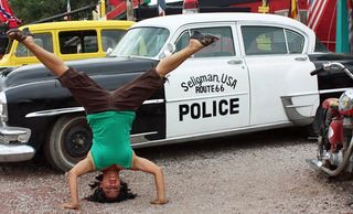 Route 66 tourists have fun and entertain each other as they travel the USA on Route 66