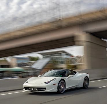 White exotic coupe, available on request