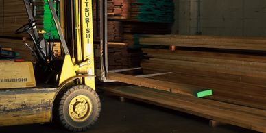 forklift moving wood around