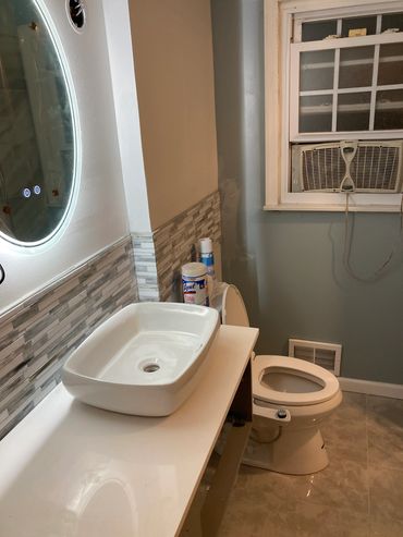 Renovated bathroom with floating vanity.