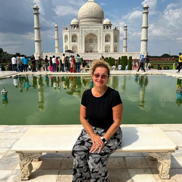 Jude Russo Caserta, Jude's Luxury Travel owner on the Princess Diana bench at the Taj Mahal