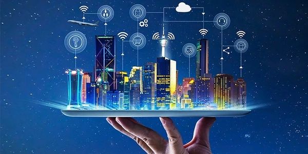 Hand holding a digital smart city with wireless network icons.