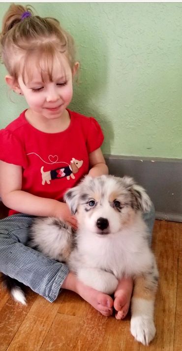 little girl and her puppy