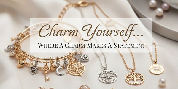 Elegant charm bracelets and necklaces with inspirational pendants on a soft background.