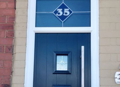 Custom made leaded top light glass with door number. This Composite door was fitted in Huthwaite