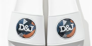 White slides with D&J logo on top.