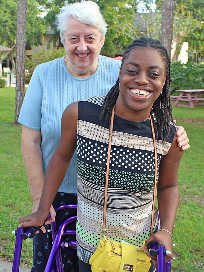 An AIM retreatant and her buddy in an award-winning photo by Linda Reeves of the Florida Catholic.