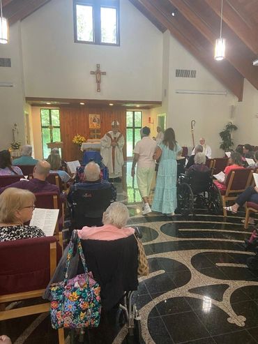 The offertory gifts are brought to the altar during Mass.