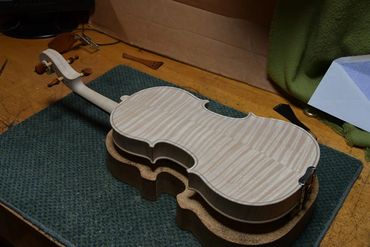 Luthier's jig securing guitar body for precise shaping