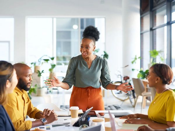 Woman leading a team meeting in an office.