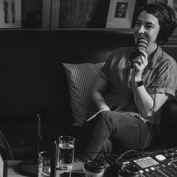 Bel sitting on a coach talking