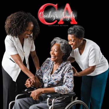 Two caregivers warmly assist an elderly woman in a wheelchair, smiling and supportive.