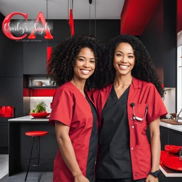 Two smiling healthcare professionals in red scrubs in a modern kitchen.