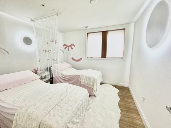 Our treatment room with two beds and partition