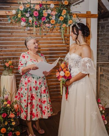 Jen in a Hell Bunny 50s style dress in green with pink roses