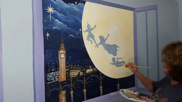 Peter Pan themed mural painted in a children's bedroom in Menifee, CA by Jill Roberts.