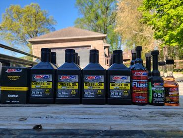 AMSOIL Max Duty Signature Series 15W-40 Diesel Oil, Diesel Fuel Additive, and Engine Oil Flush.