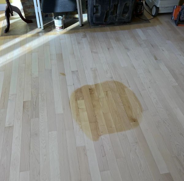 Natural water based polyurethane sample tested on a sanded maple hardwood floor.