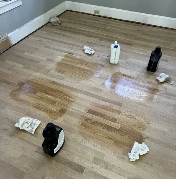 Hardwood floor stain samples tested on a sanded floor