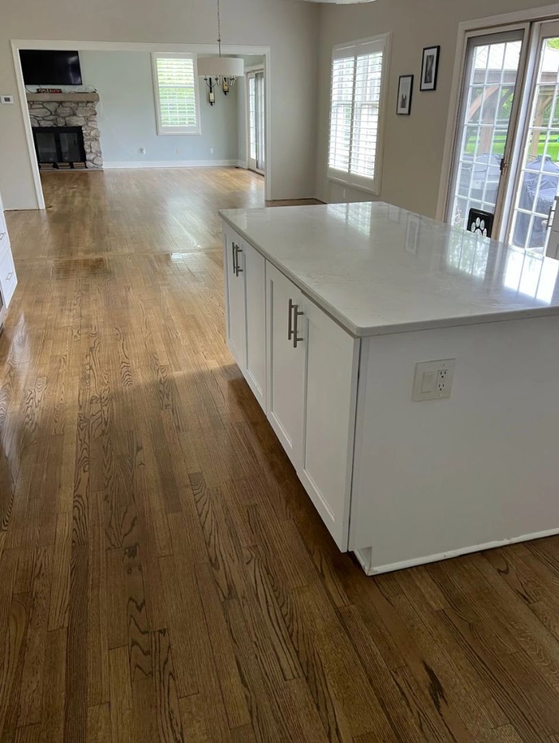 Photo of the completed North Ridgeville kitchen, with the living room and dining room partially visi