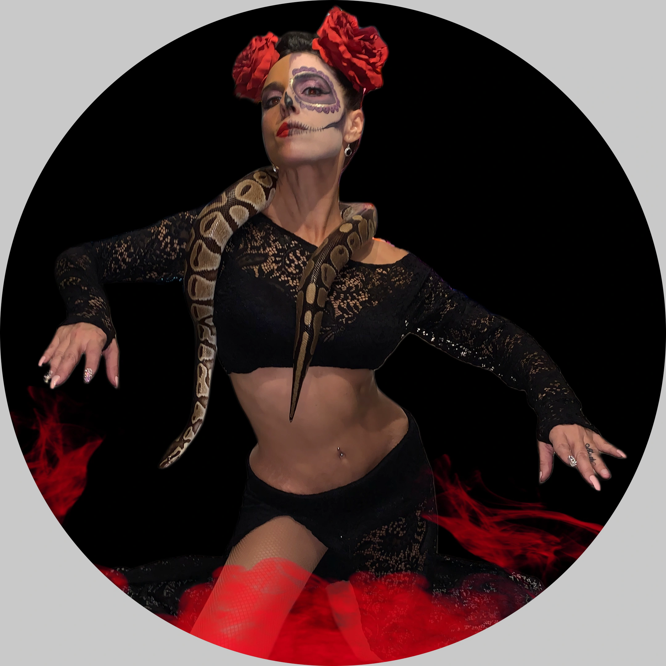 Bellydancer with snake wrapped around her neck in Halloween costume.