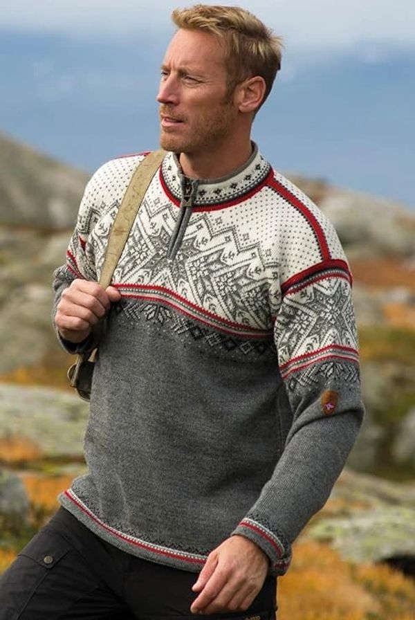 A man hiking outdoors wearing a Norwegian sweater from Dale of Norway