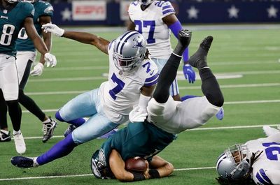 Jalen Hurts of the Philadelphia Eagles gets destroyed by some Dallas Cowboys player.