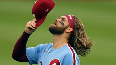 Bryce Harper of the Philadelphia Phillies admires his hat on PhillySportsComplex.