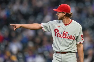 Aaron Nola of the Philadelphia Phillies points at something, back when he was able to pitch.