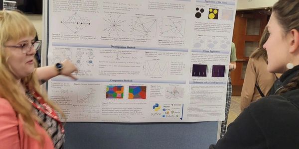 Presenting research at the Conference for Undergraduate Women and Gender Minorities in Physics