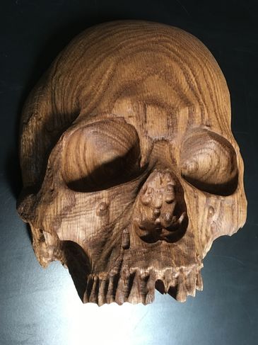 Life-sized 3D skull carved out of white oak