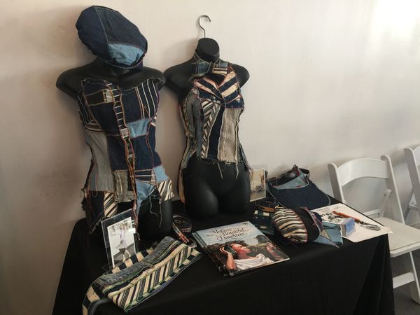Denim mannequins displayed with accessories
