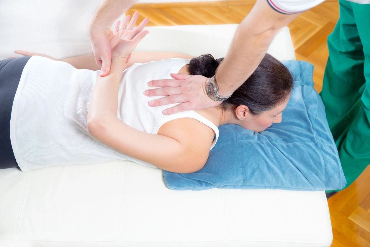 Chiropractor massage patient spine and back

