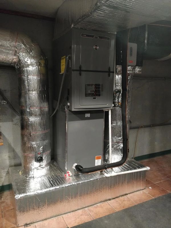 Ruud high efficiency gas furnace. 96% AFUE. Custom downflow installation. Modern high smart home sys